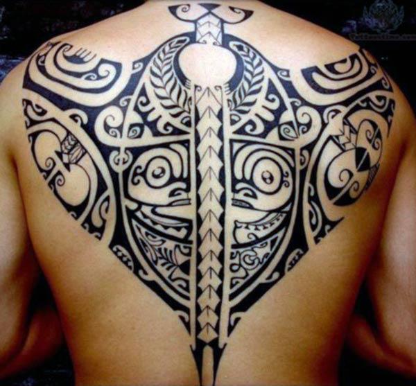 Spectacular intense black Hawaiian tribal back tattoo ideas for Guys