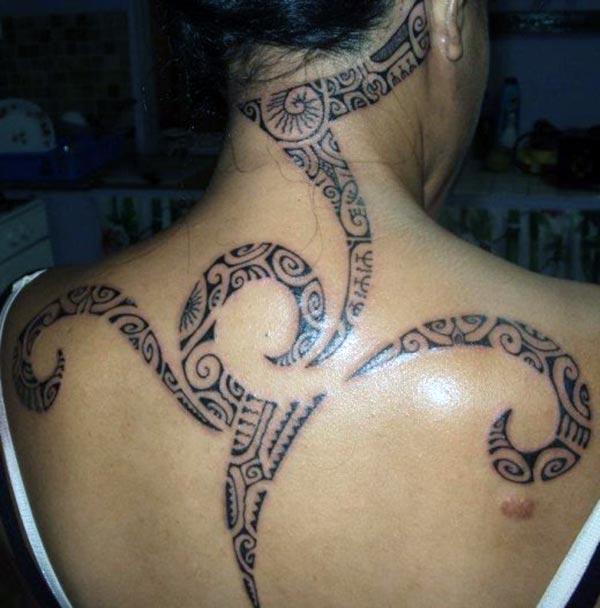 On Women’s back - Beautiful artistic Hawaiian Tribal Tattoo