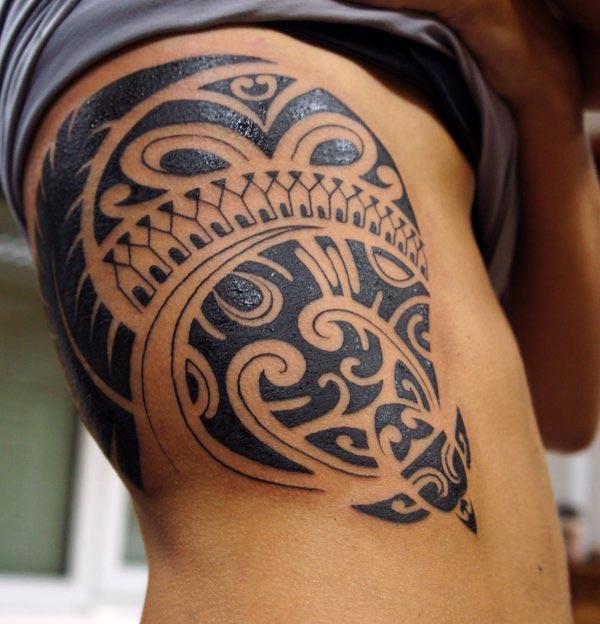 Striking broad black Hawaiian tribal tattoo with turtle ideas on Women’s belly side