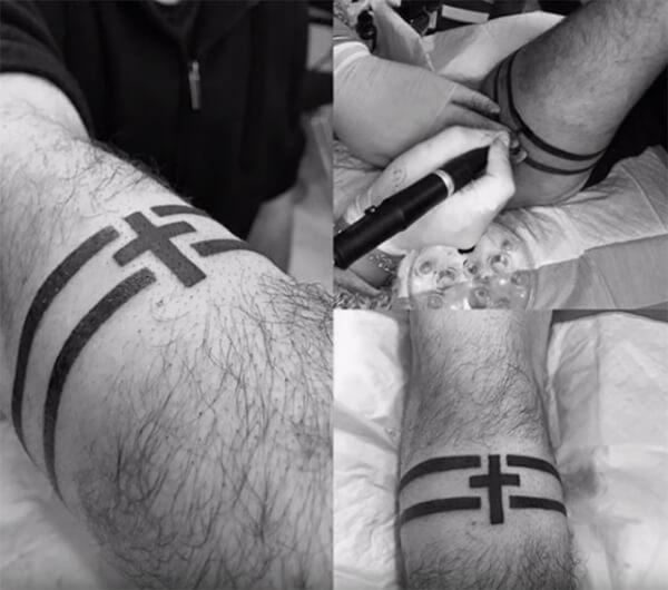 Spectacular black cross tattoo arm band design for guys
