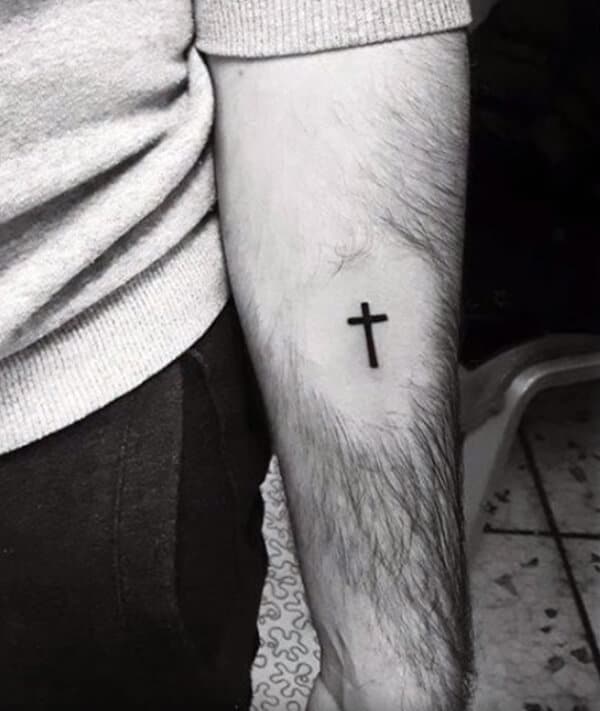 Small cute cross tattoo design on forearm for boys and men