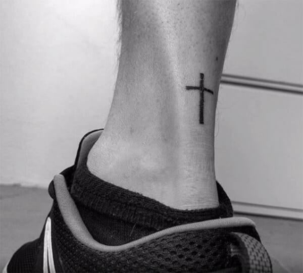 Simple small cross tattoo ideas on leg for guys