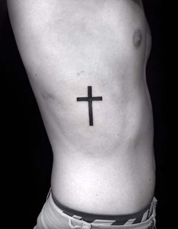 Appealing black cross tattoo ideas for Men on side rib