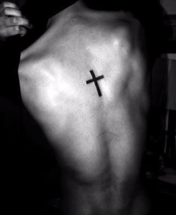 Small and attractive black cross tattoo ideas on back for guys