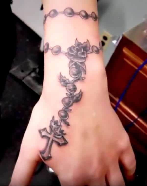 Lovely cross pendant tattoo ideas on wrist for ladies