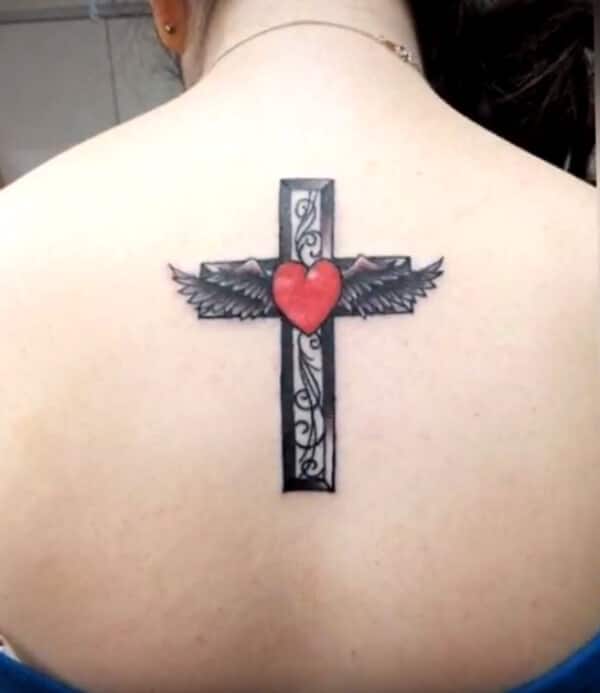 Beautiful cross with wings and heart tattoo ideas on back for women and girls