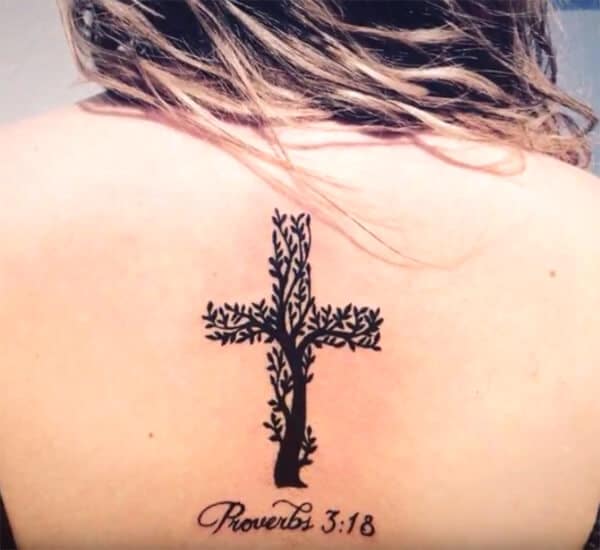 Eye-catchy tree cross tree tattoo designs on back for women