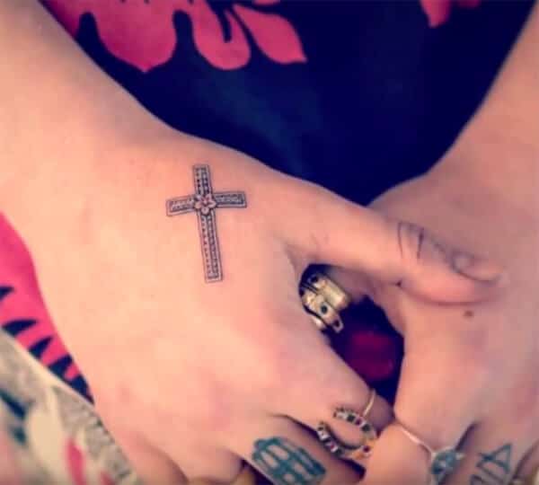 Beautiful intricate cross with flower tattoo ideas on palm for Ladies