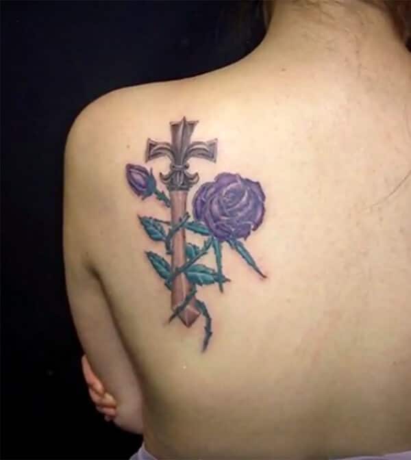 Captivating mystique cross with flowers tattoo design on back shoulder for Girls and women