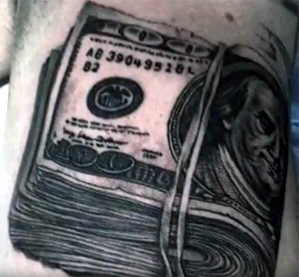 Jaw-dropping money bundle tattoo ideas for Guys on shoulder
