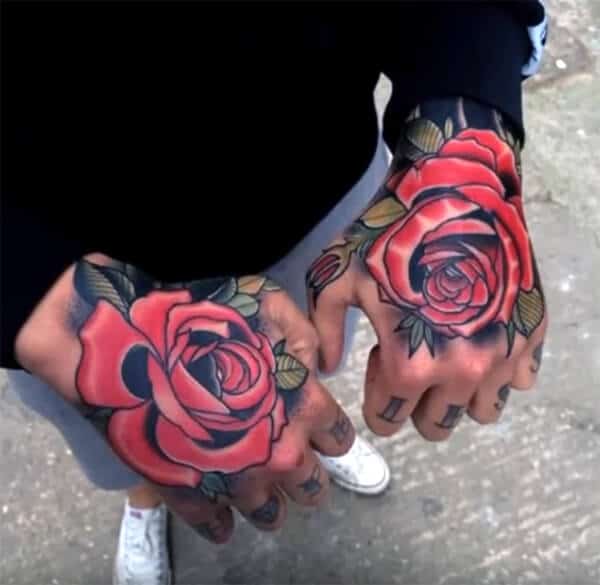 Impressive artistic red rose tattoo ideas for Guys on hand