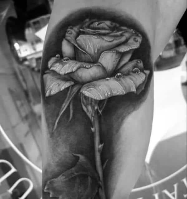 Wonderful realistic rose tattoo ideas for Men on leg