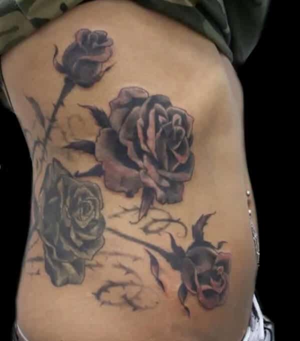 Magnificent roses tattoo designs on side ribs for Ladies