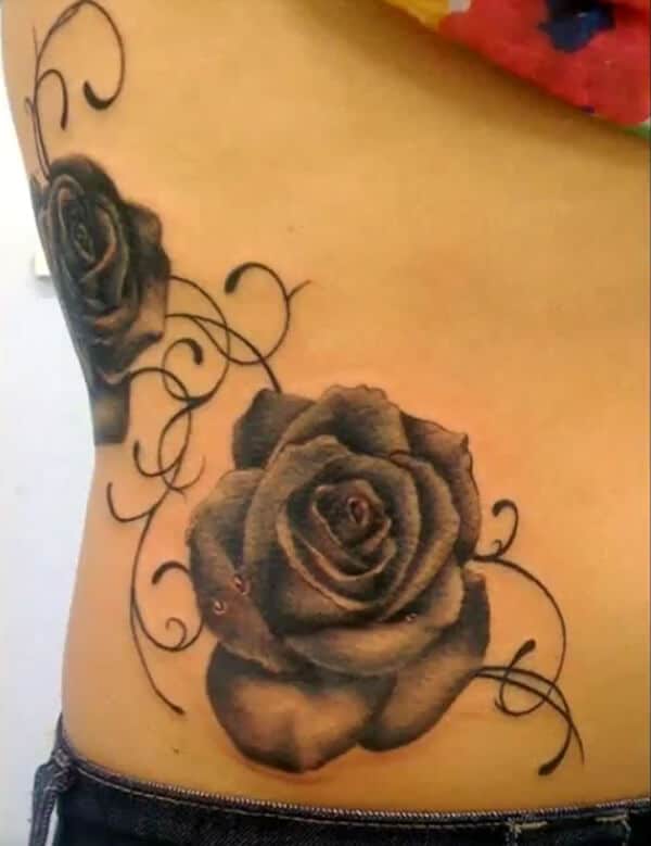 Charming rose tattoo ideas on belly side for ladies