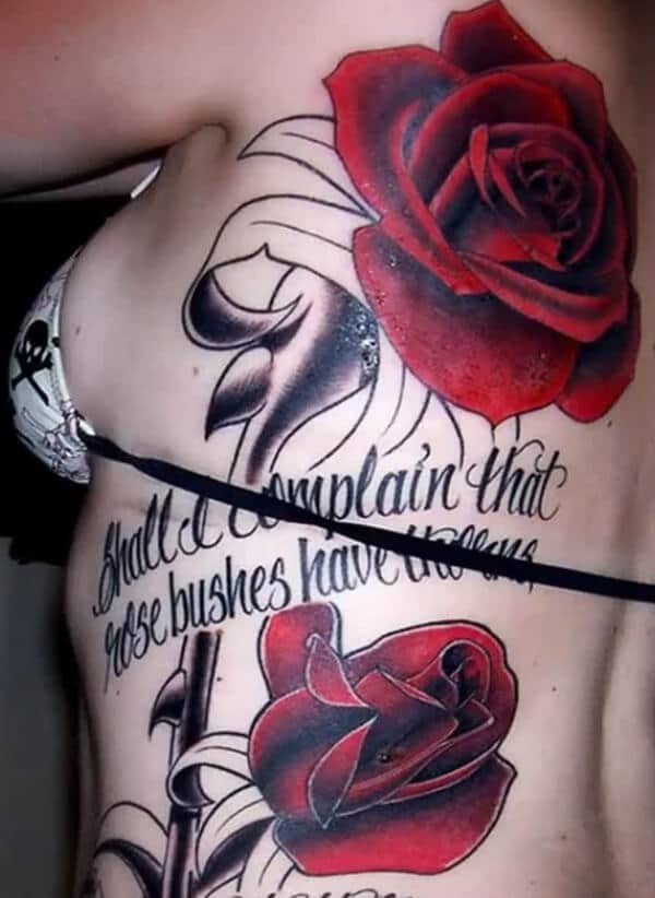 Heavenly magnificent red roses with wording tattoo ideas on side rib for Women