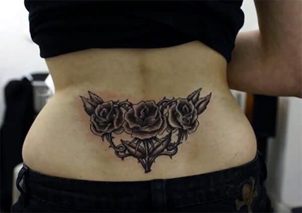 Engaging rose tattoo ideas on lower back for Women