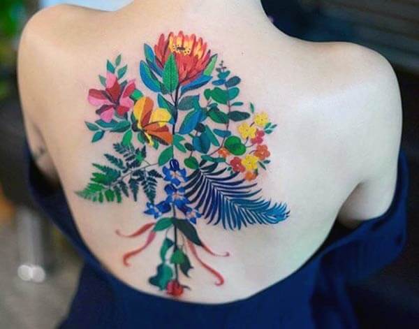 vibrant floral back tattoo design ideas for girls and women