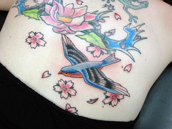 lovely bird tattoo design on back for ladies