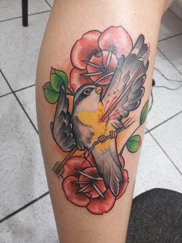 impressive artistic bird tattoo design on leg for women