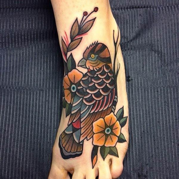 enthralling bird tattoo design on feet for girls and women