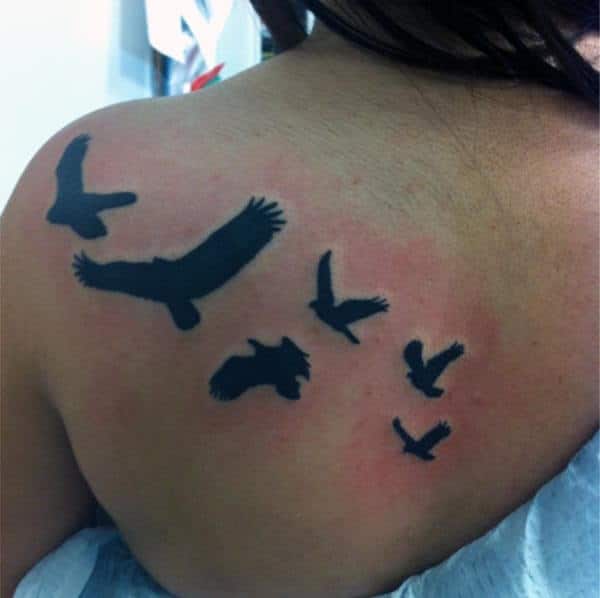 black flying bird tattoo designs on back shoulder for Women
