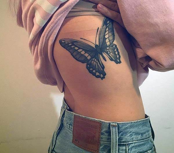 An exquisite butterfly tattoo design on side rib for girls