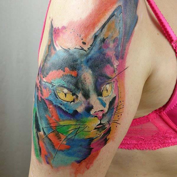 enthralling watercolor cat tattoo design on arm for girls and women