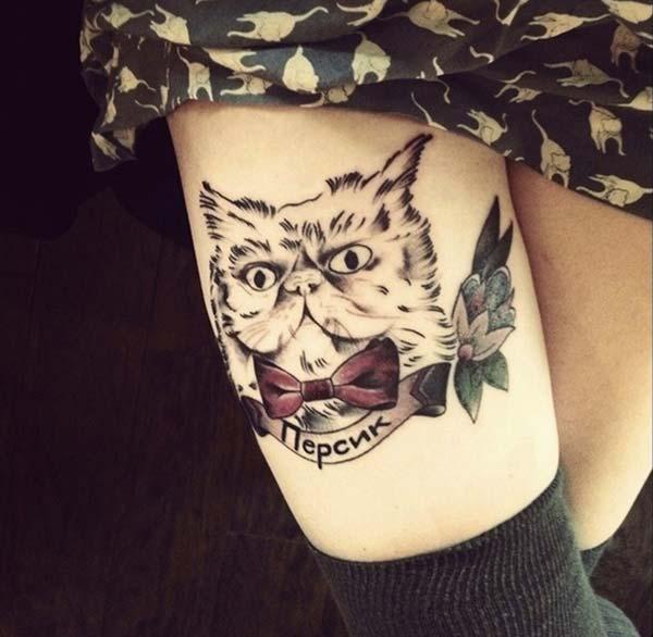 adorable and captivating cat tattoo design on thigh for cat loving girls