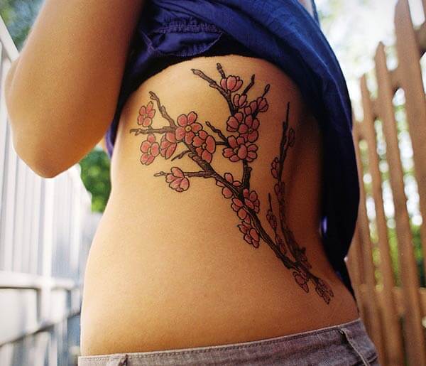 good-looking cherry blossom tattoo design on back for Girls