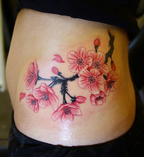 eye-catchy cherry blossom tattoo design on side rib for Ladies
