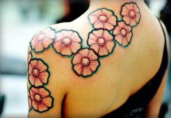 eye-catchy cherry blossom tattoo design on back shoulder for girls