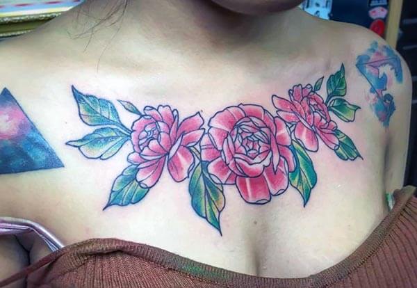 classic floral chest tattoo design for ladies