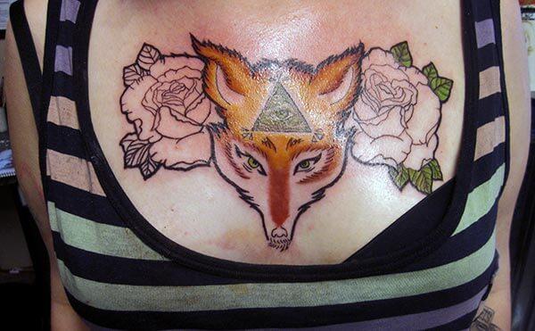 wild and classy chest tattoo design for ladies