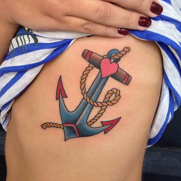 A beautiful anchor with heart tattoo designs on belly side for ladies 