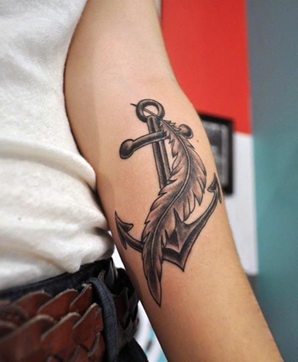 An enchanting feather on anchor tattoo ideas for ladies on forearm