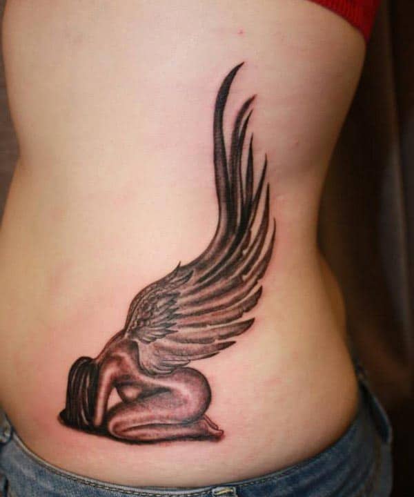 captivating angel with large wings tattoo designs on side belly for ladies and girls
