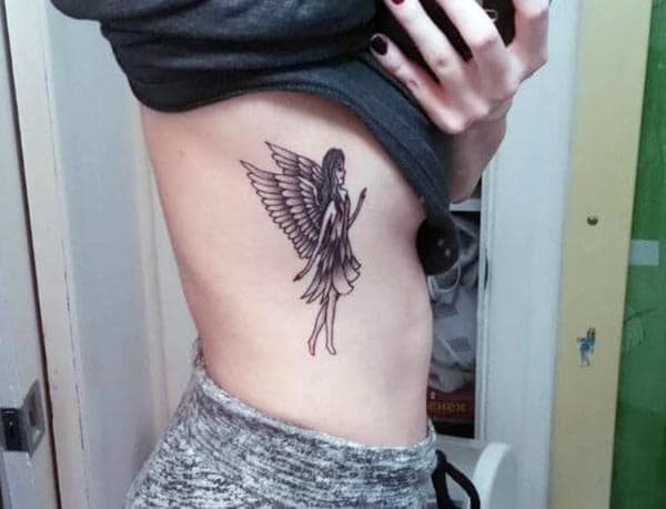 chic style angel tattoo ideas on side belly for girls and women