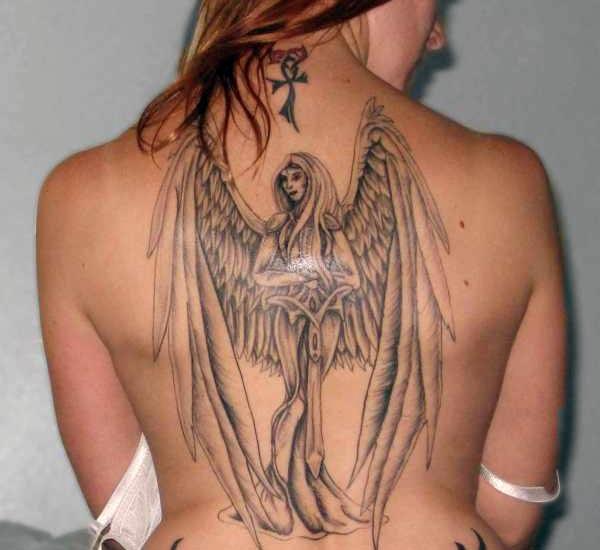 mind blowing tattoo design of angel with huge wings on back 