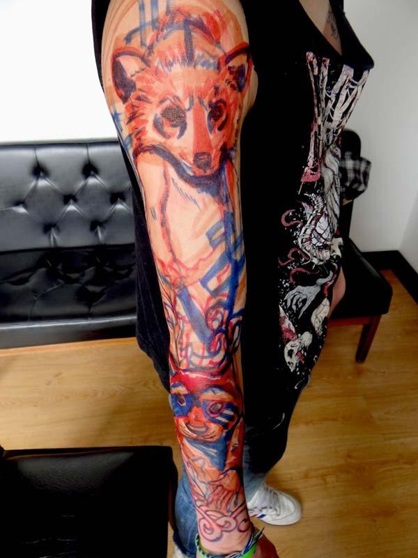 Multi-colored animal tattoo ideas on full arm for girls 