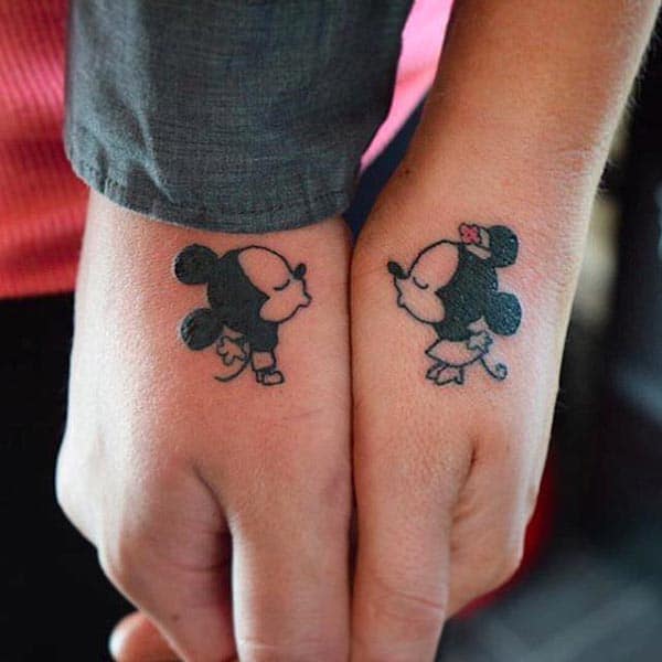 A cute couple tattoo design on thumb finger for lovers