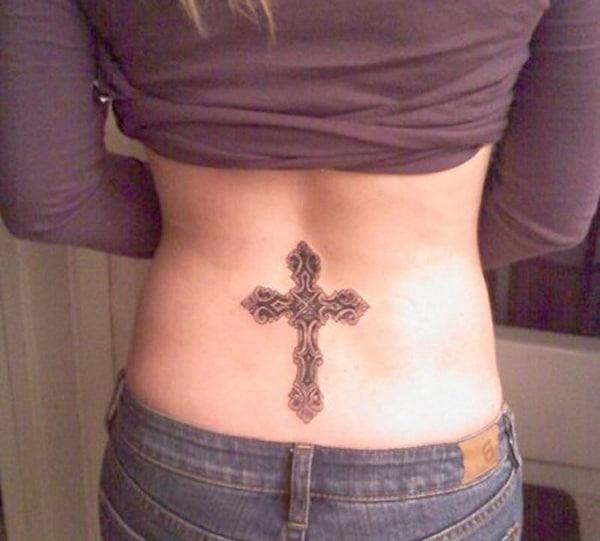 An eye-catchy cross tattoo design on back for Ladies
