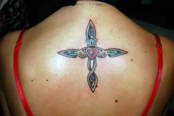 A unique stylish cross tattoo design on back shoulder for Ladies