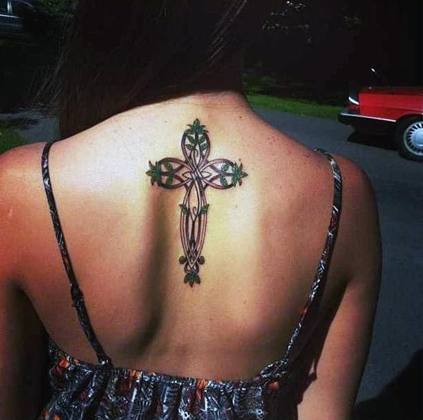 An aesthetic looking cross tattoo design on back for Girls