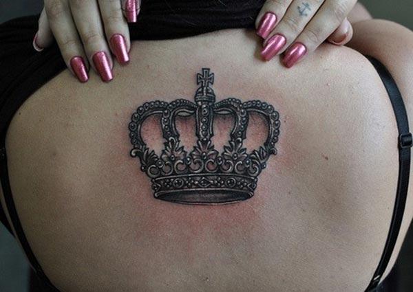 A ravishing crown tattoo design on back for Girls