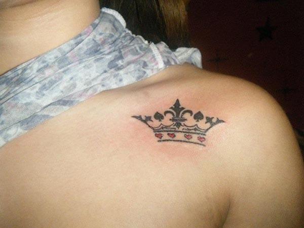 A lovely tiny crown tattoo design on front shoulder for girls and ladies