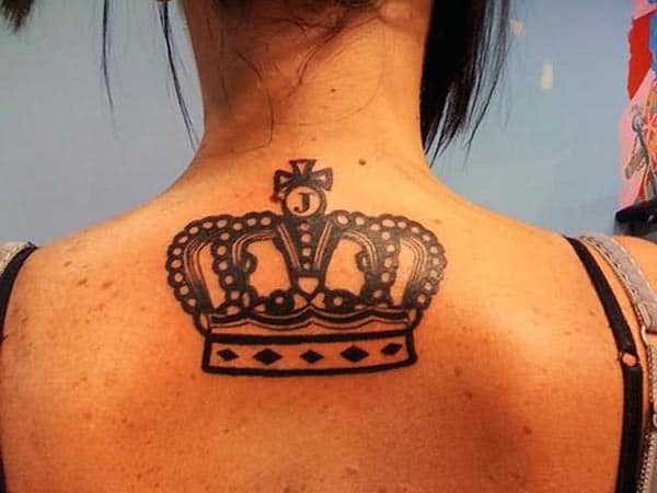 An eye-catchy bold black crown tattoo design on back for Ladies