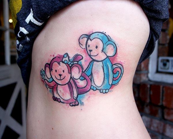 A lovely vibrant monkey tattoos on side belly for women