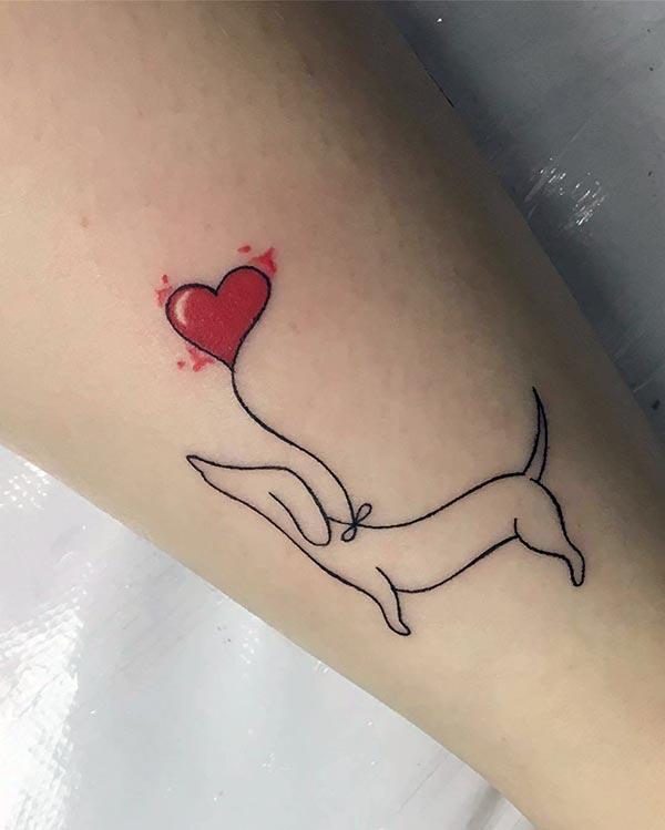An attractive cute dog tattoo design for dog loving ladies