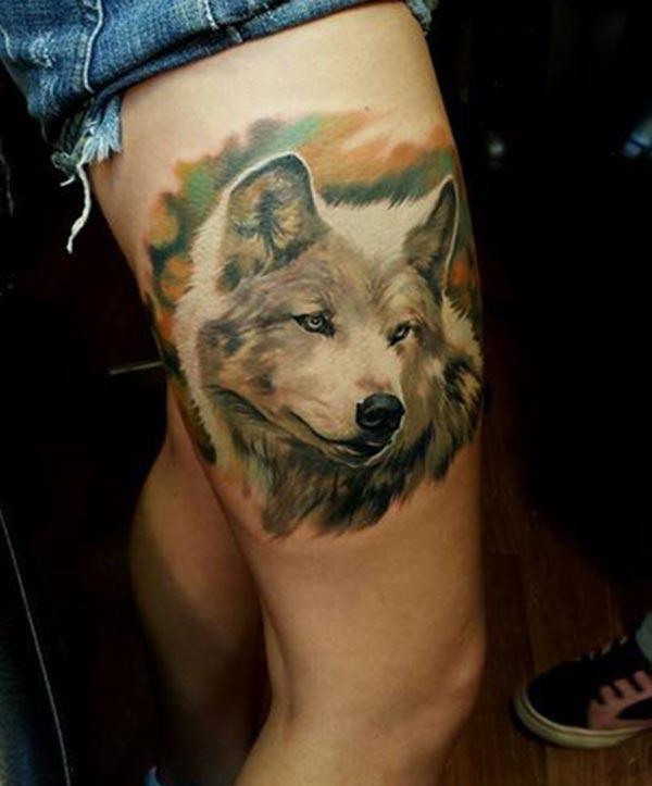 An eye-catchy dog tattoo design on thighs for Girls