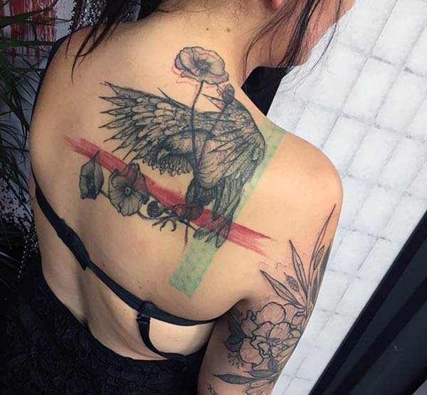 A distinctive eagle tattoo design on back shoulder for Women